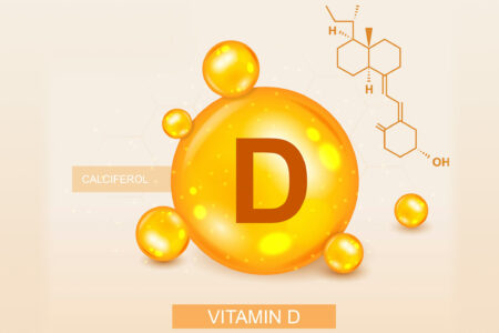 Illustration mit einem großen, leuchtenden orangefarbenen Buchstaben D, umgeben von kleineren Sphären, neben einem Diagramm der chemischen Struktur von Calciferol, beschriftet mit "Vitamin D" auf einem sanften pfirsichfarbenen Hintergrund mit einem subtilen geometrischen Muster.